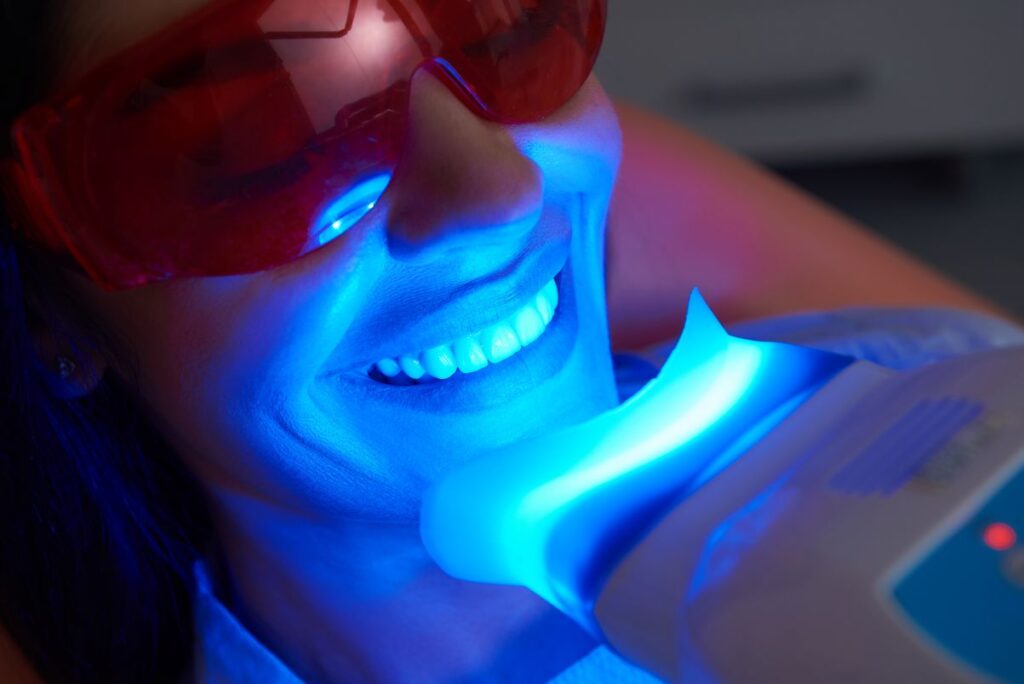 A woman getting her teeth professionally whitened